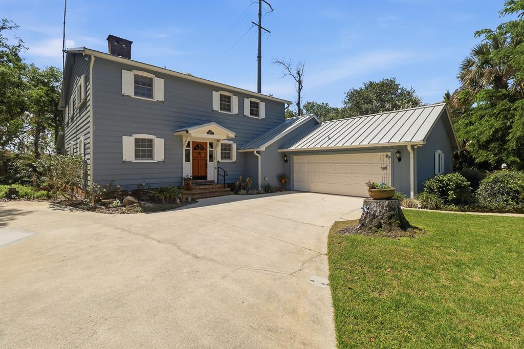6491 Spruce Creek Road Port Orange, FL 32127 - Photo 65 of 73 a front view of a house with yard