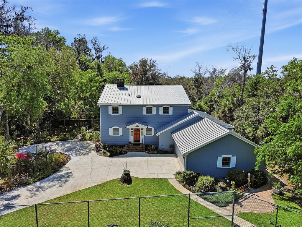 6491 Spruce Creek Road Port Orange, FL 32127 - Photo 69 of 73 a aerial view of a house with a yard
