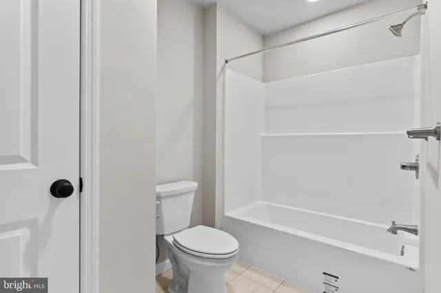 a bathroom with a shower and a toilet
