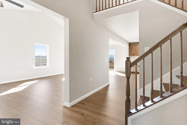 a view of an entryway with wooden floor