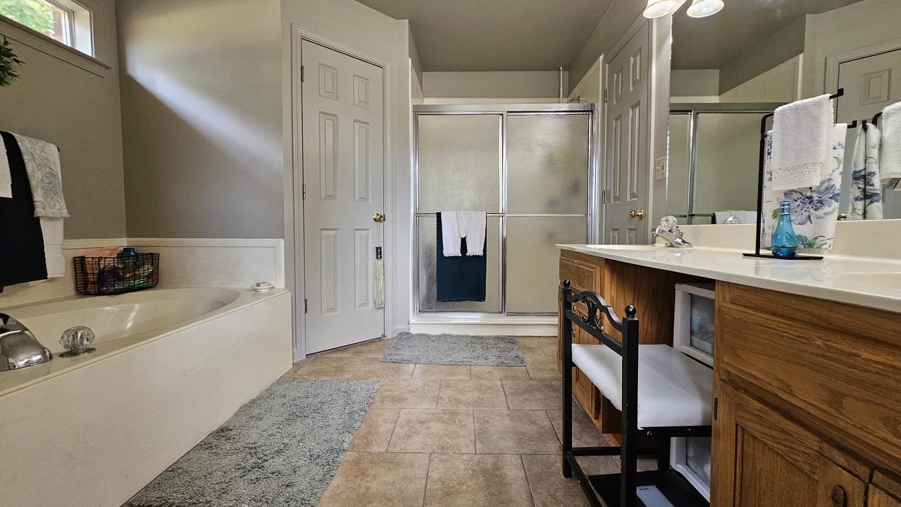 9919 Millington Arlington Road Arlington, TN 38002 - Photo 12 of 22 a bathroom with a tub sink and mirror