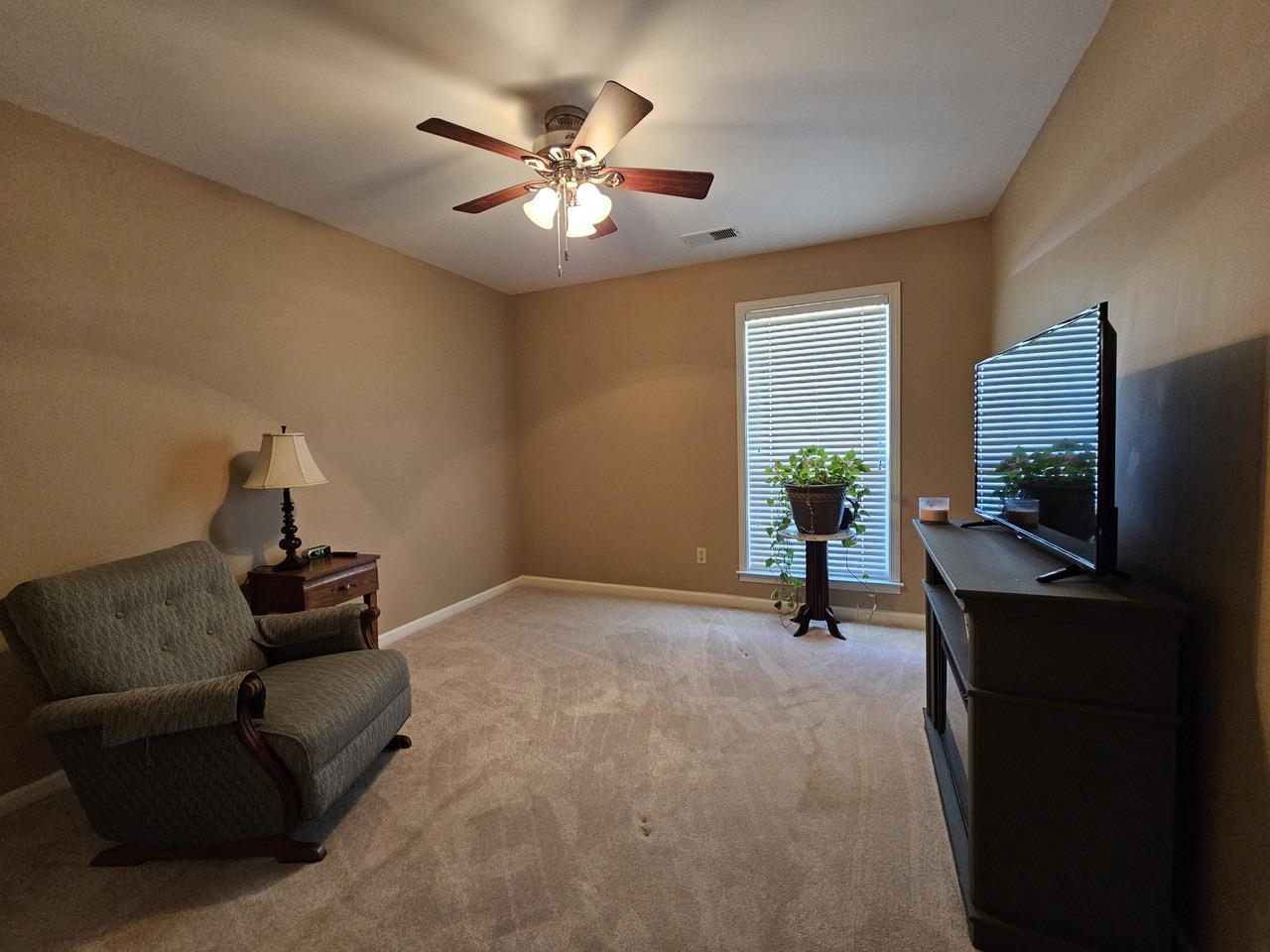 9919 Millington Arlington Road Arlington, TN 38002 - Photo 13 of 22 a living room with furniture and a flat screen tv