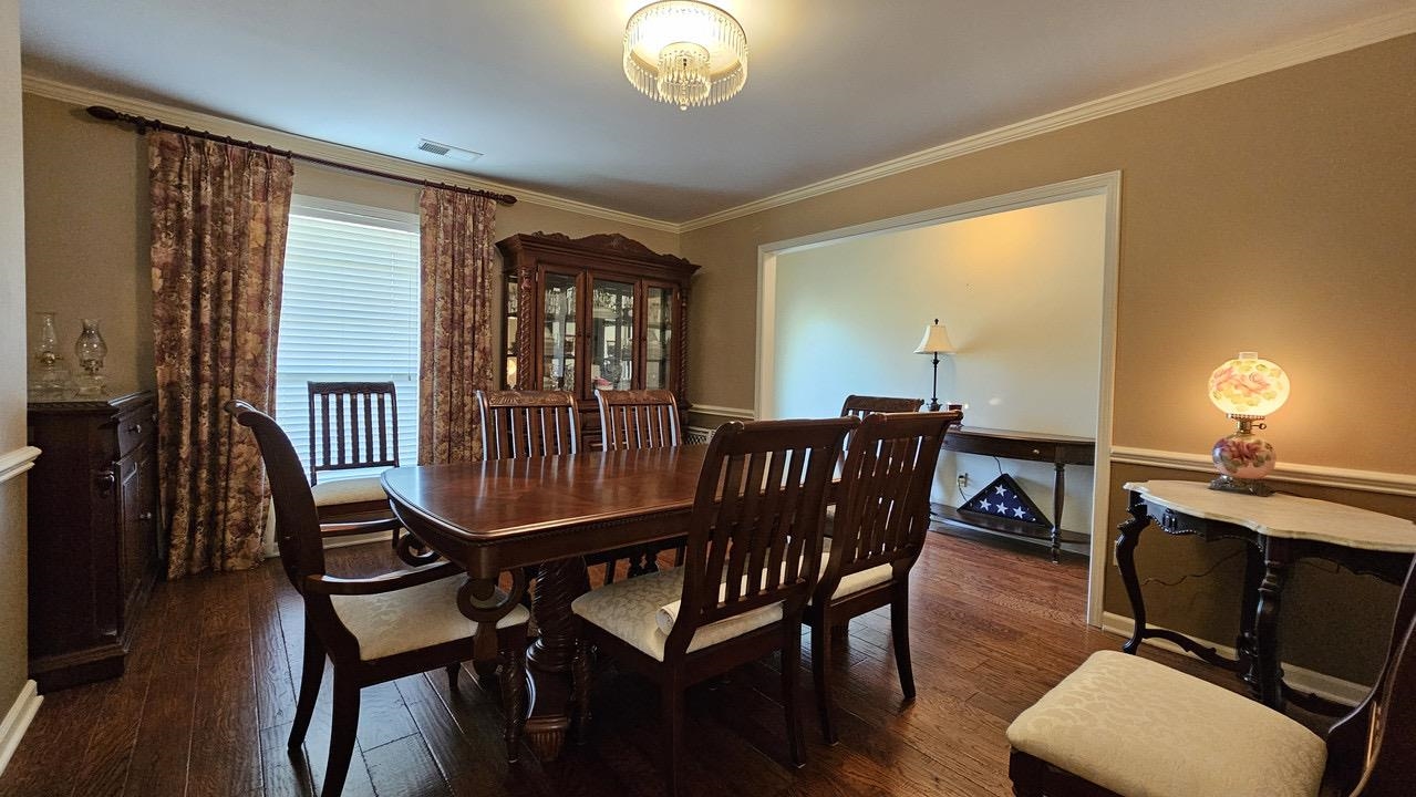 9919 Millington Arlington Road Arlington, TN 38002 - Photo 15 of 22 a view of a dining room with furniture window and wooden floor