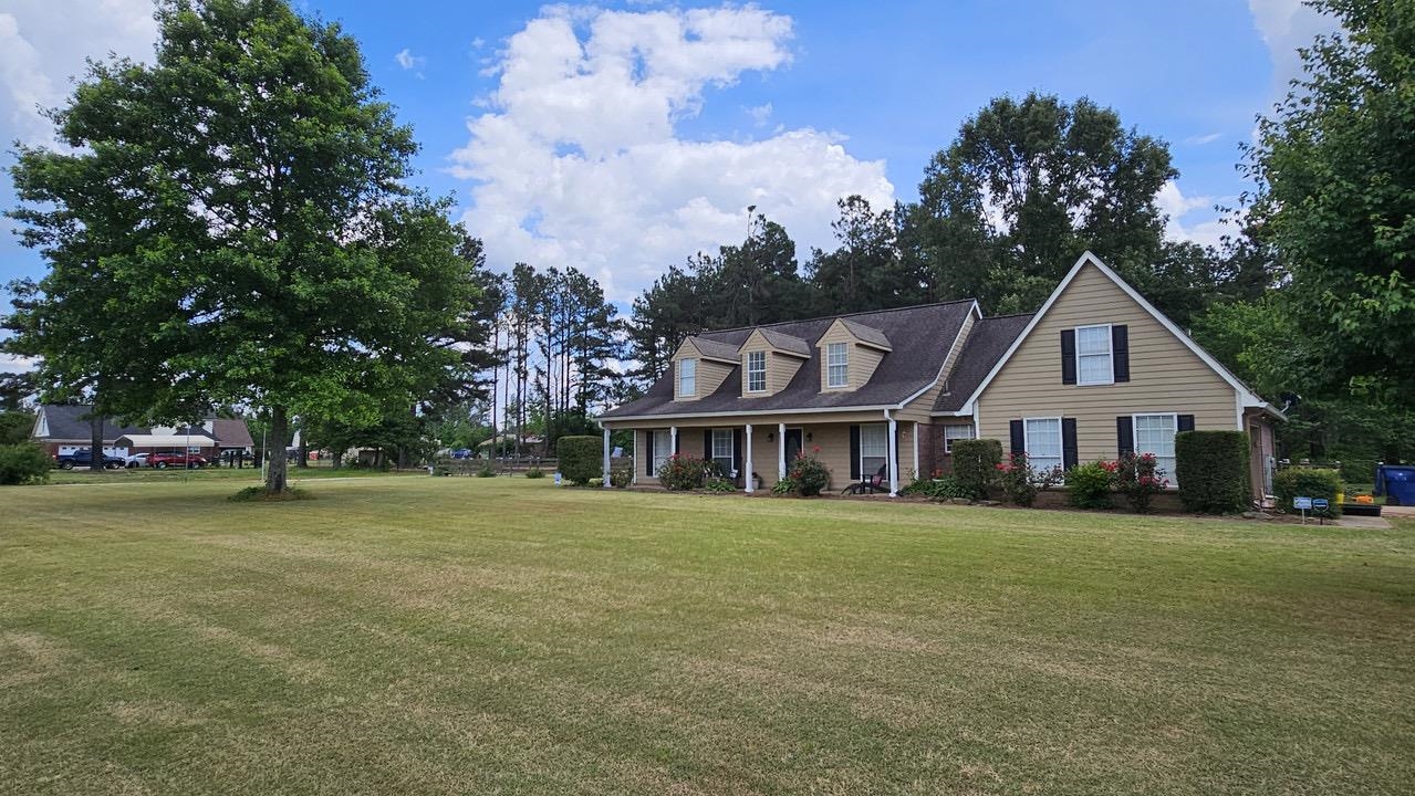 9919 Millington Arlington Road Arlington, TN 38002 - Photo 20 of 22 a front view of a house with a garden