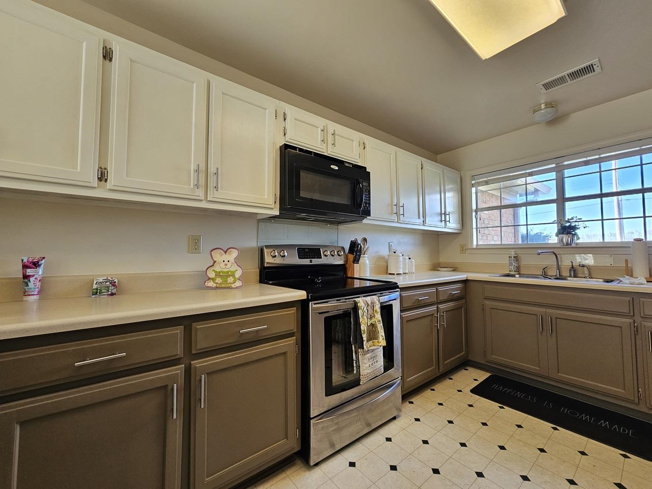 9919 Millington Arlington Road Arlington, TN 38002 - Photo 2 of 22 a kitchen with granite countertop a sink stainless steel appliances and white cabinets