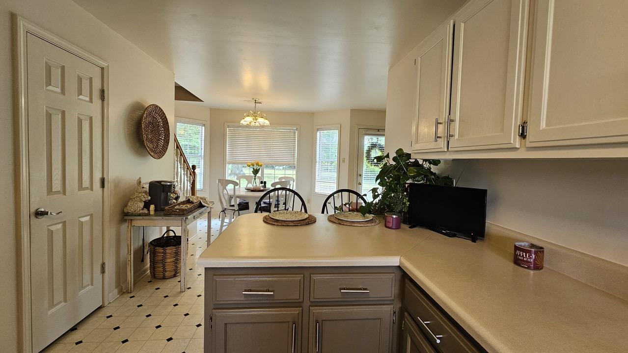 9919 Millington Arlington Road Arlington, TN 38002 - Photo 3 of 22 a kitchen with a sink a stove and cabinets