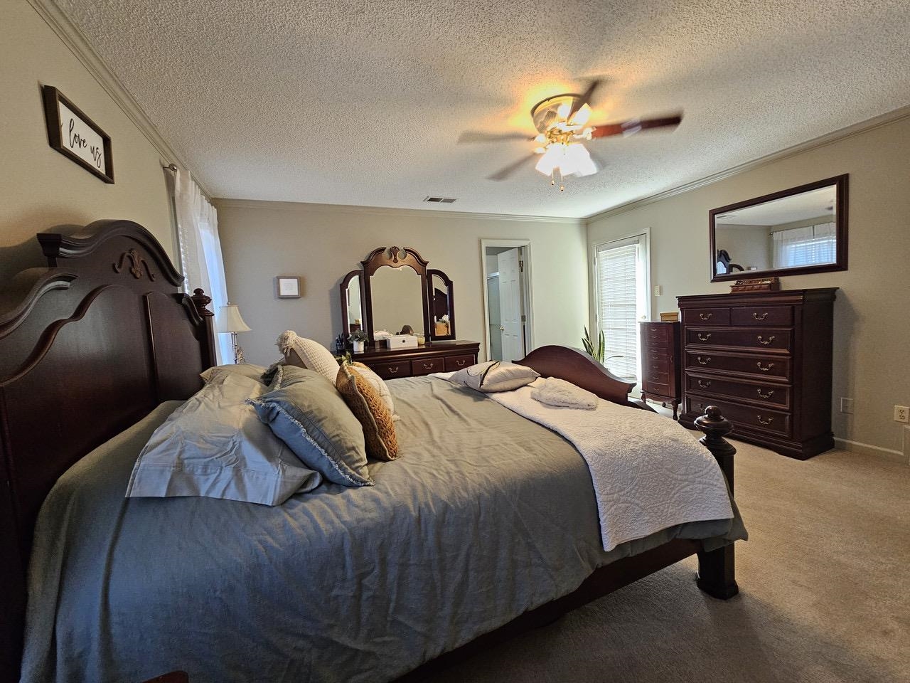 9919 Millington Arlington Road Arlington, TN 38002 - Photo 8 of 22 a bedroom with a bed and a chandelier