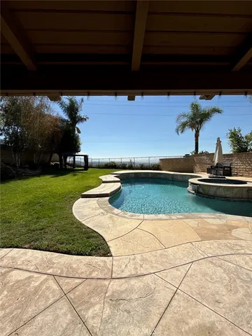 a view of swimming pool with outdoor seating