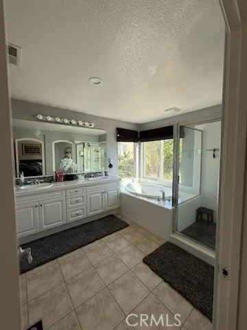a kitchen with a stove a sink and a refrigerator