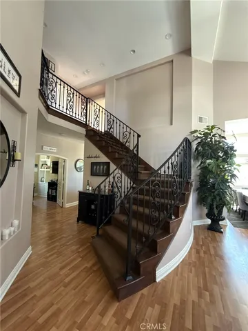 a living room with furniture or wooden floor and a chandelier