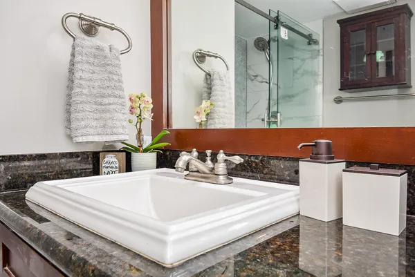 a bathroom with a bathtub and shower