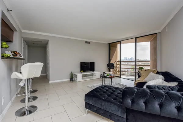 a living room with furniture and a window