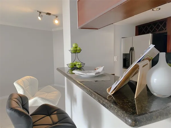 a dining room with furniture and entryway