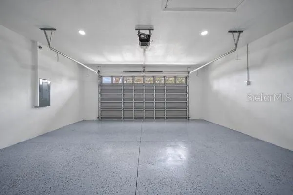 a view of an empty room with windows