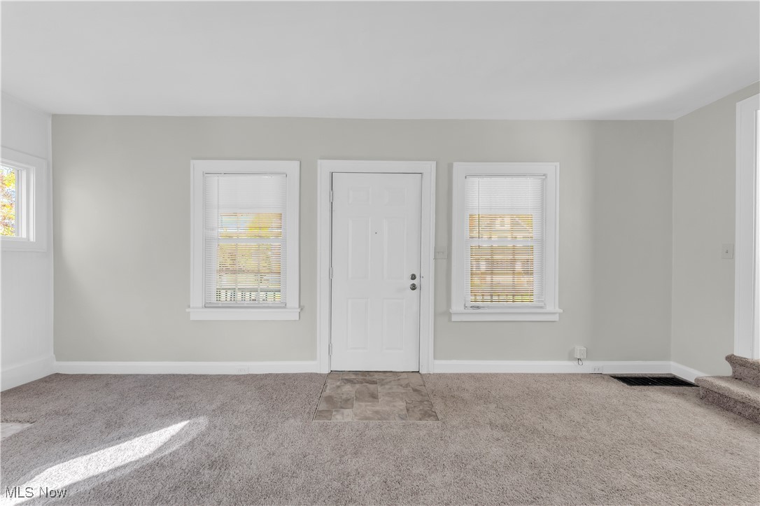 945 Nela View Road Cleveland Heights, OH 44112 - Photo 5 of 27 Foyer entrance with carpet and plenty of natural light