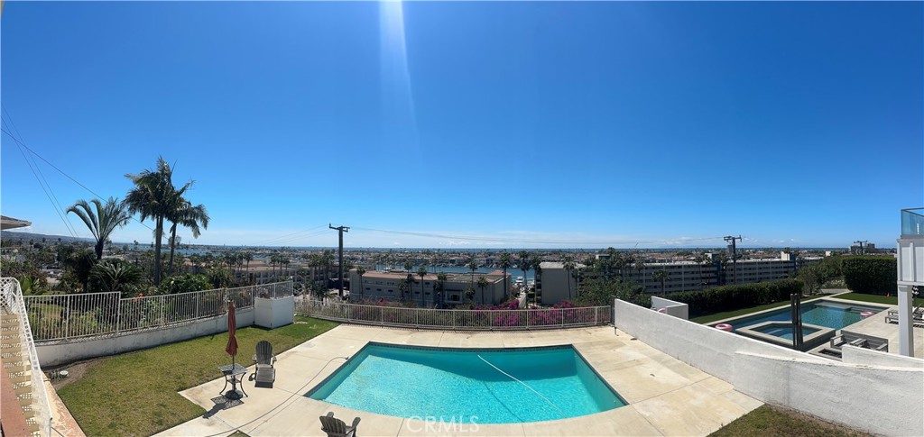 1221 Kings Road Newport Beach, CA 92663 - Photo 2 of 14 a view of a swimming pool with a patio