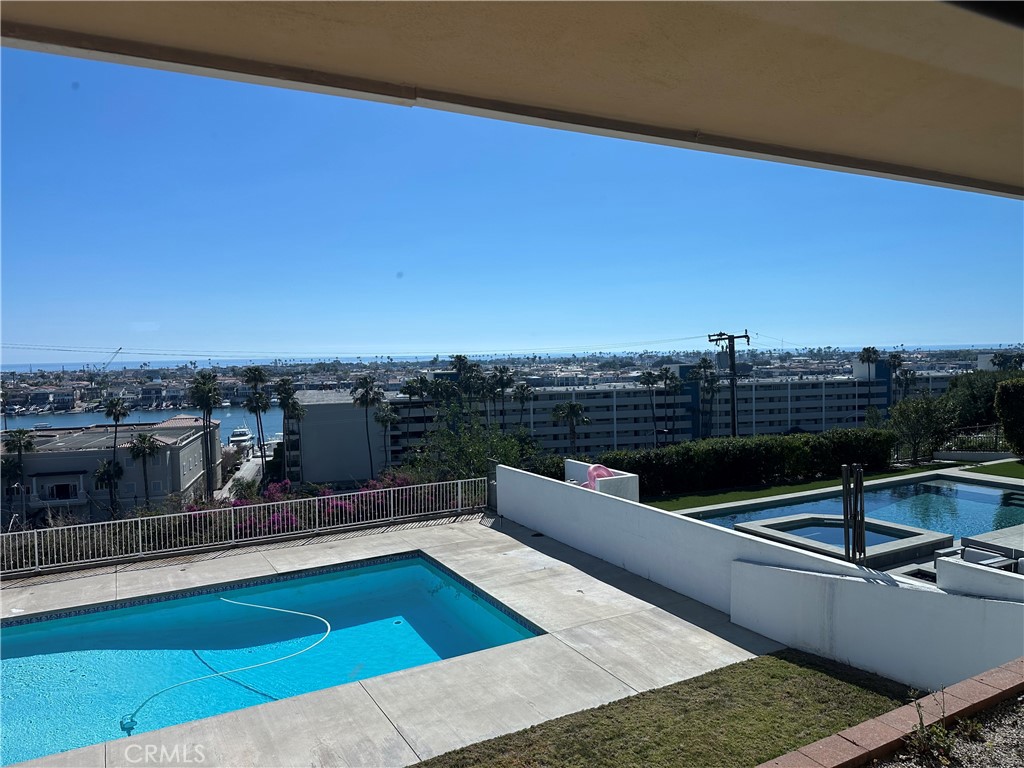 1221 Kings Road Newport Beach, CA 92663 - Photo 8 of 14 a view of a swimming pool with a terrace