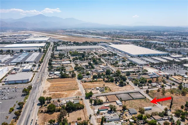 an aerial view of multiple houses with yard