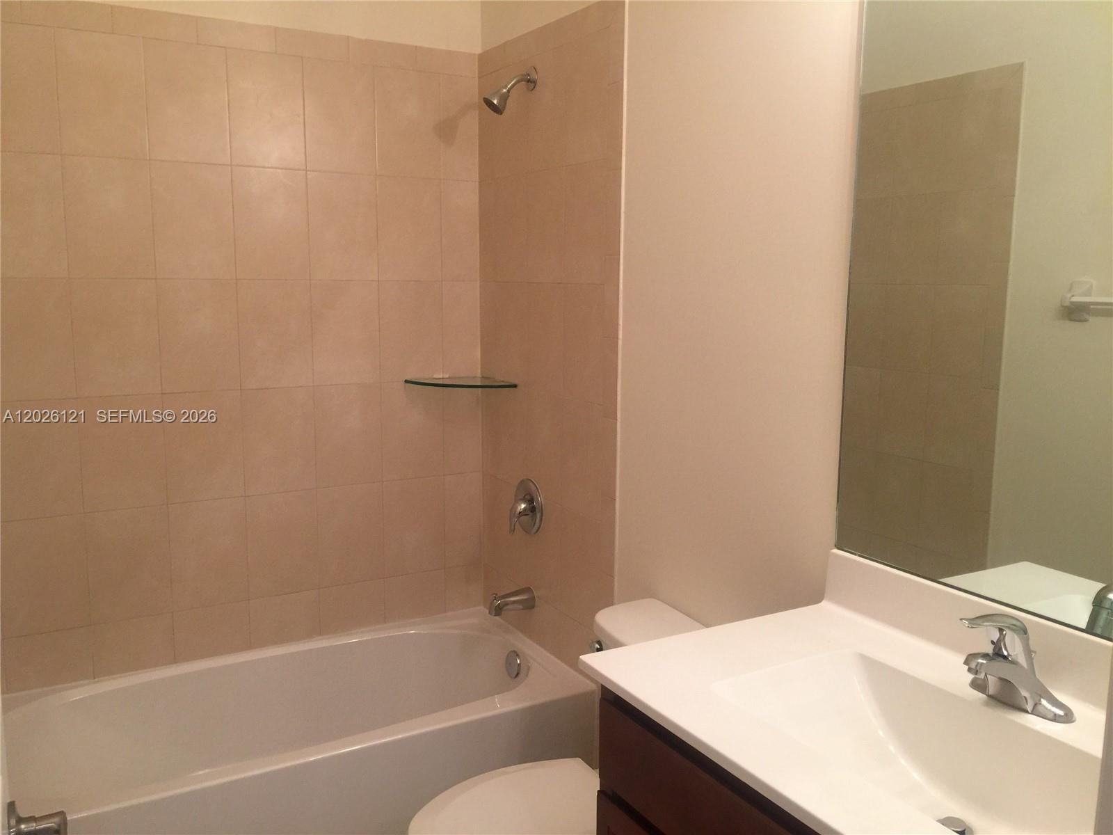 9307 West 33rd Way Hialeah, FL 33018 - Photo 15 of 23 a bathroom with a sink and a bathtub