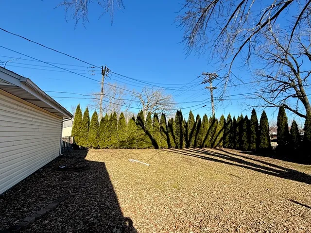 a view of a backyard of the house