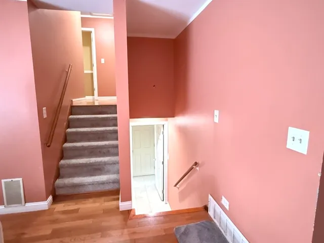 a view of entryway with wooden floor