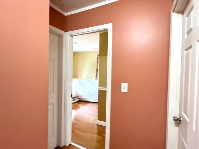 a view of a bedroom from a hallway