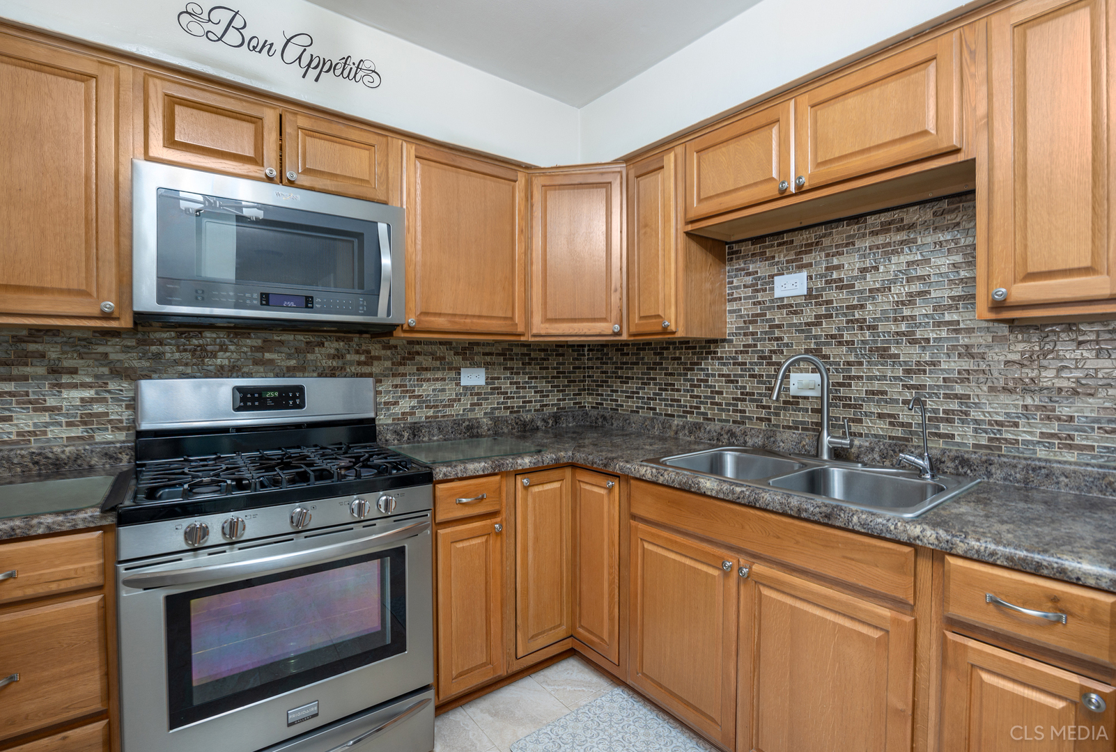 20 North Albert Street Mount Prospect, IL 60056 - Photo 6 of 25 a kitchen with granite countertop a sink stove and cabinets