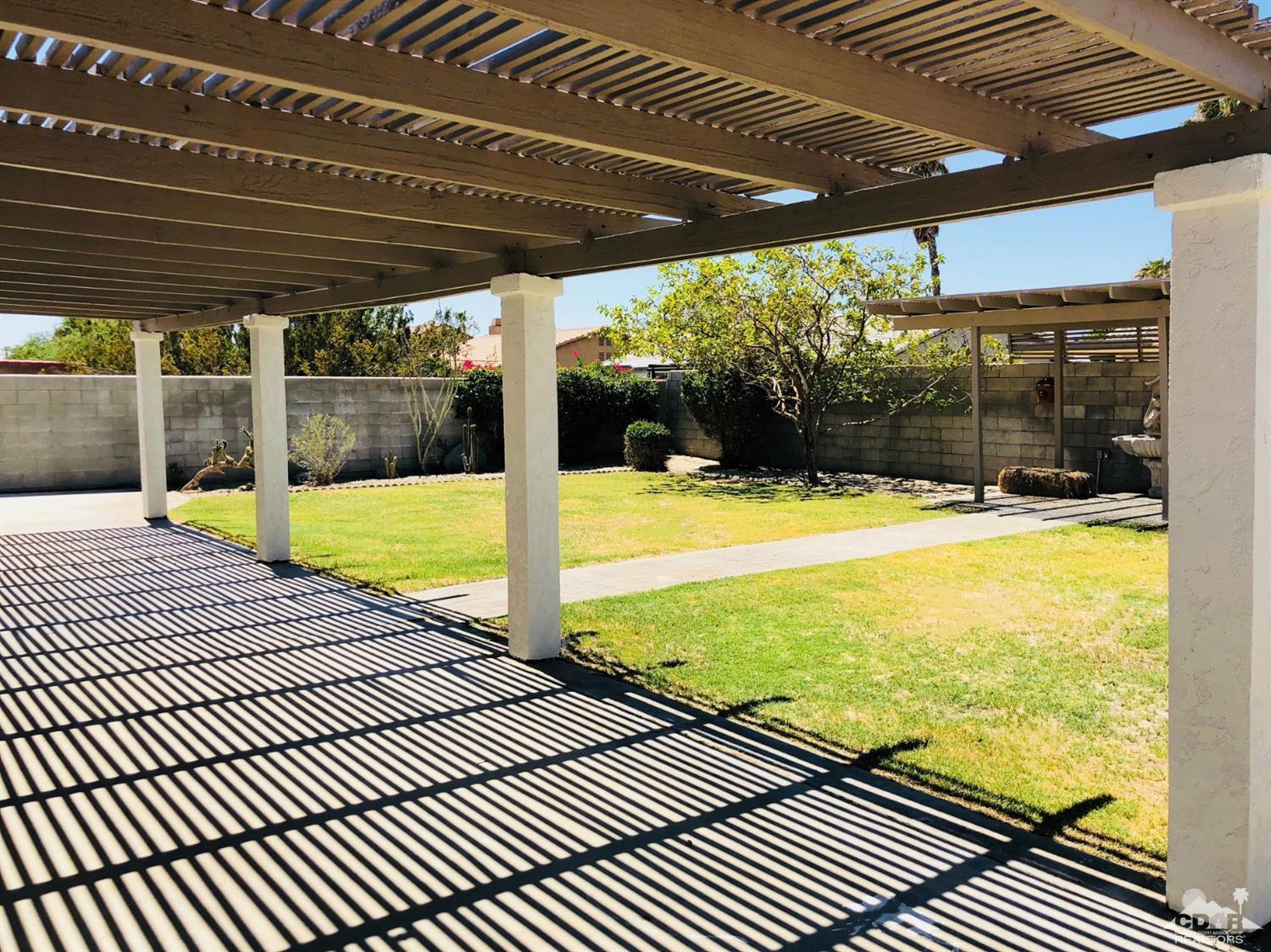 68185 Encinitas Road Cathedral City, CA 92234 - Photo 14 of 14 a view of a swimming pool with a porch
