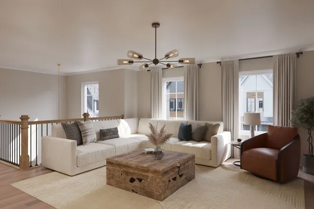 a living room with furniture and a chandelier