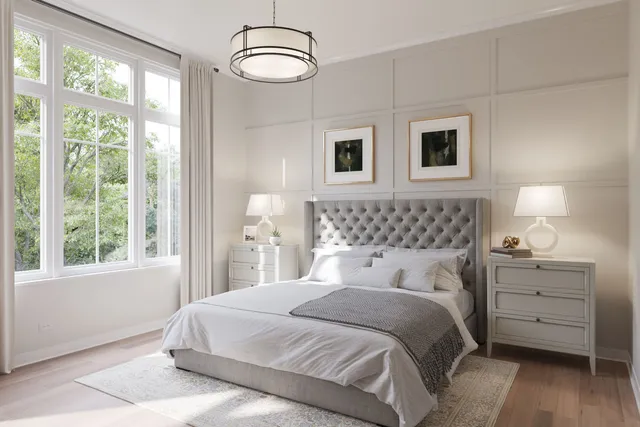 a bedroom with a large bed and a large window