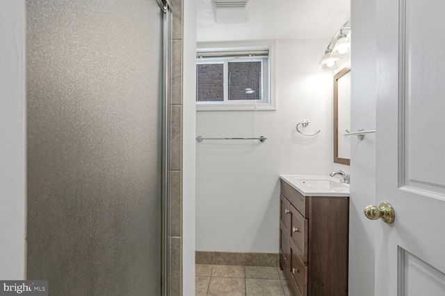 a bathroom with a sink toilet tub and shower