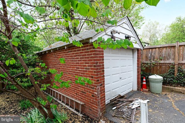 a picture of a park with furniture and next to a white wall