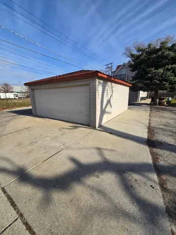 a view of garage and yard