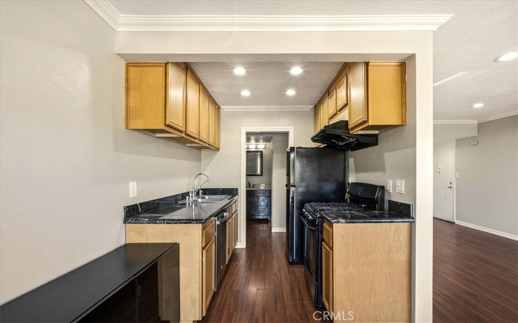 1200 West Lambert Road La Habra, CA 90631 - Photo 12 of 37 a kitchen that has a sink stainless steel appliances and cabinets