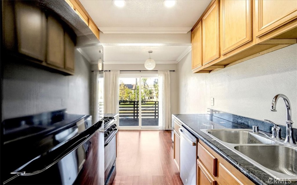 1200 West Lambert Road La Habra, CA 90631 - Photo 14 of 37 a kitchen with a sink a stove and cabinets