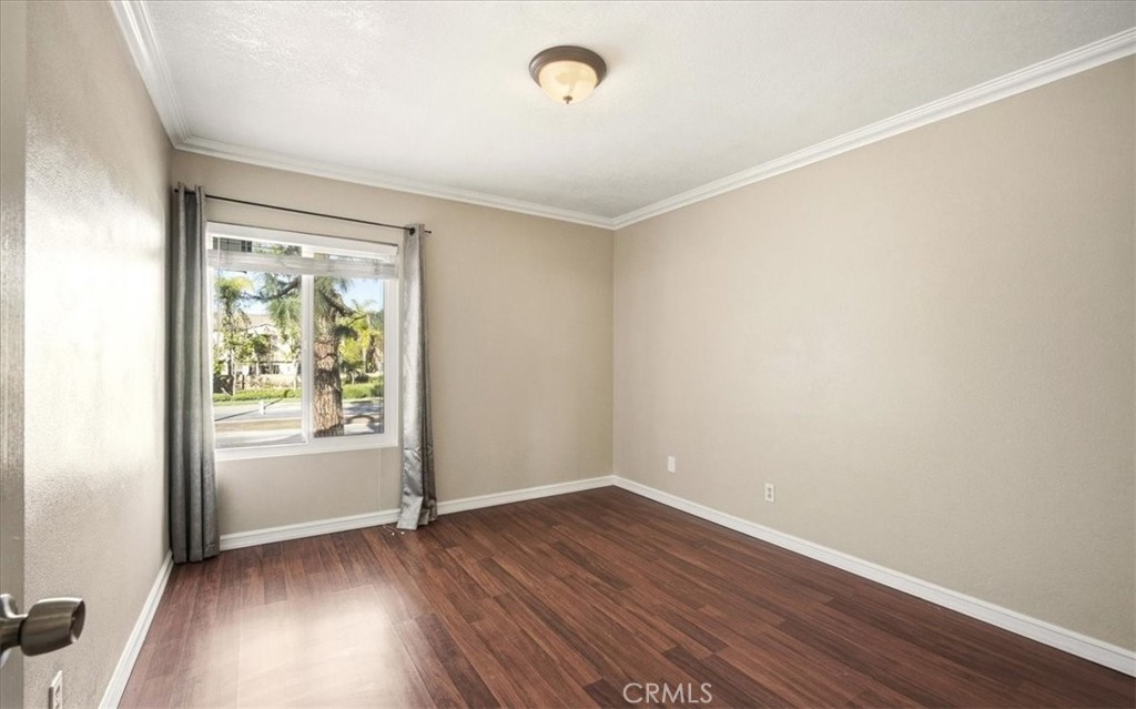 1200 West Lambert Road La Habra, CA 90631 - Photo 22 of 37 an empty room with wooden floor and windows