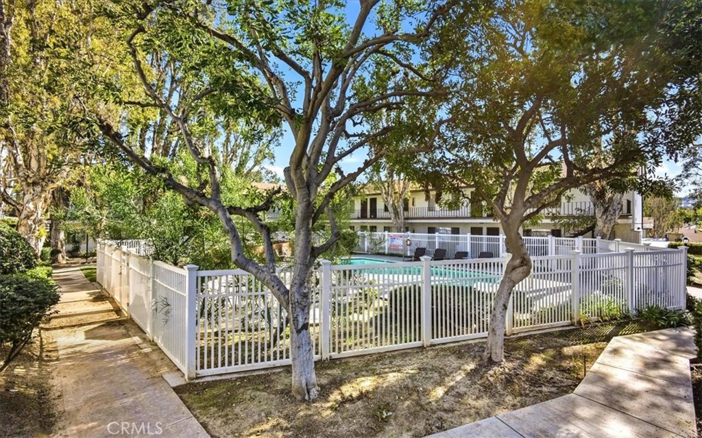 1200 West Lambert Road La Habra, CA 90631 - Photo 27 of 37 a view of a house with large tree and wooden fence