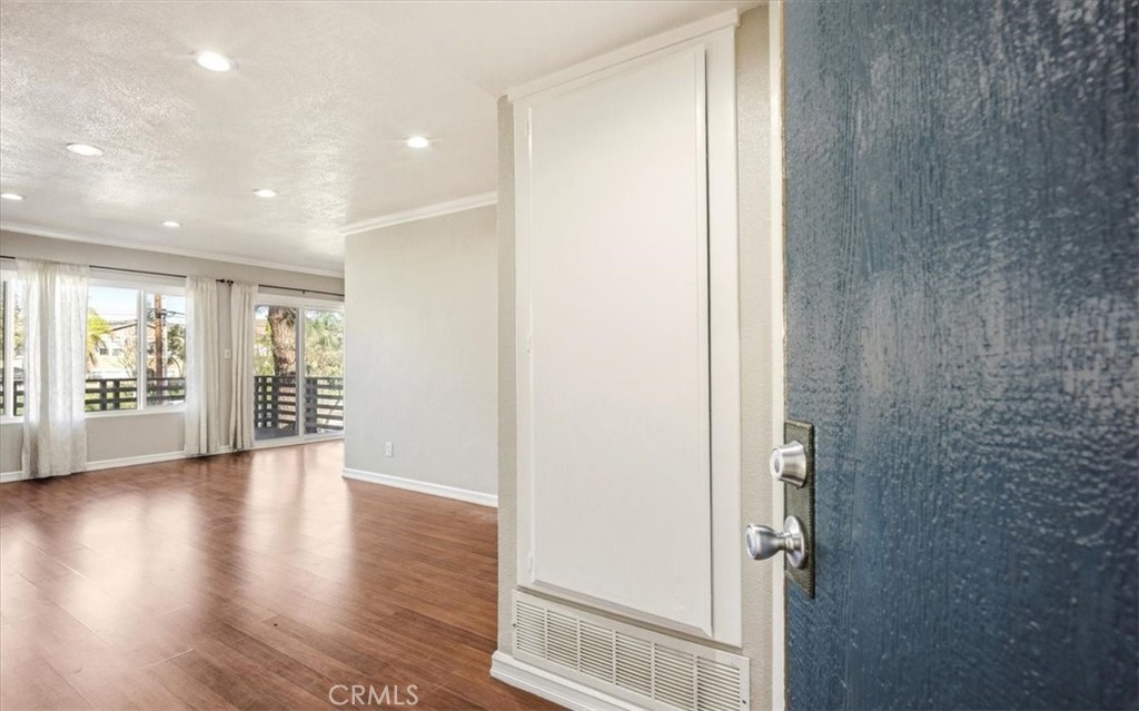 1200 West Lambert Road La Habra, CA 90631 - Photo 8 of 37 an empty room with wooden floor and windows