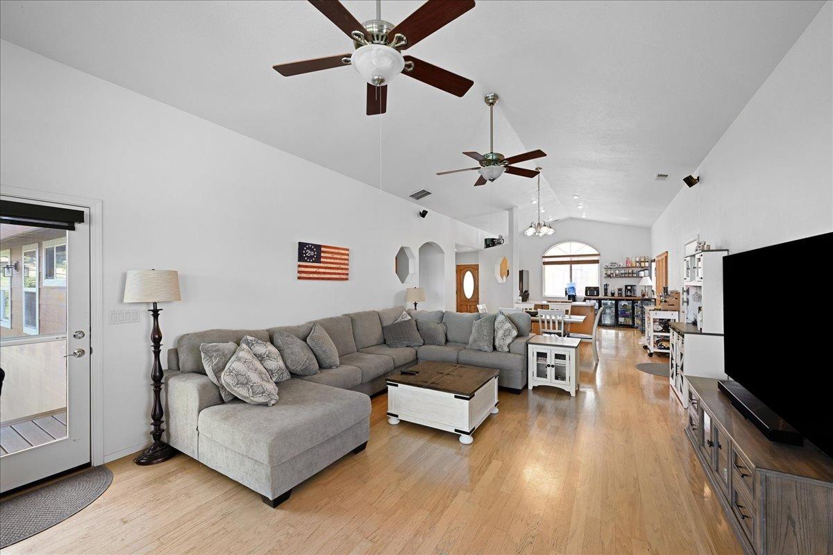 7497 McCourtney Road Lincoln, CA 95648 - Photo 24 of 73 a living room with furniture and a flat screen tv
