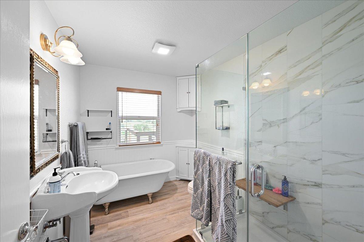 7497 McCourtney Road Lincoln, CA 95648 - Photo 25 of 73 a bathroom with a bathtub shower sink and toilet