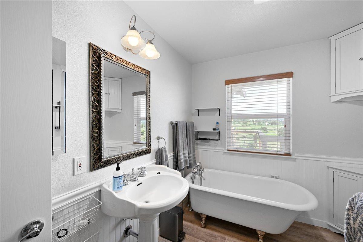 7497 McCourtney Road Lincoln, CA 95648 - Photo 26 of 73 a bathroom with a sink tub double vanity and a mirror