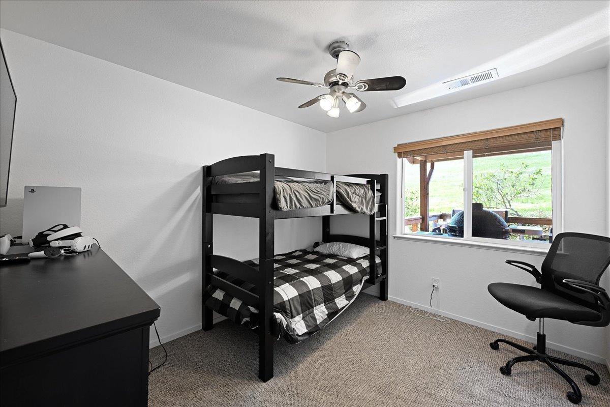 7497 McCourtney Road Lincoln, CA 95648 - Photo 27 of 73 a bedroom with a bed and a window