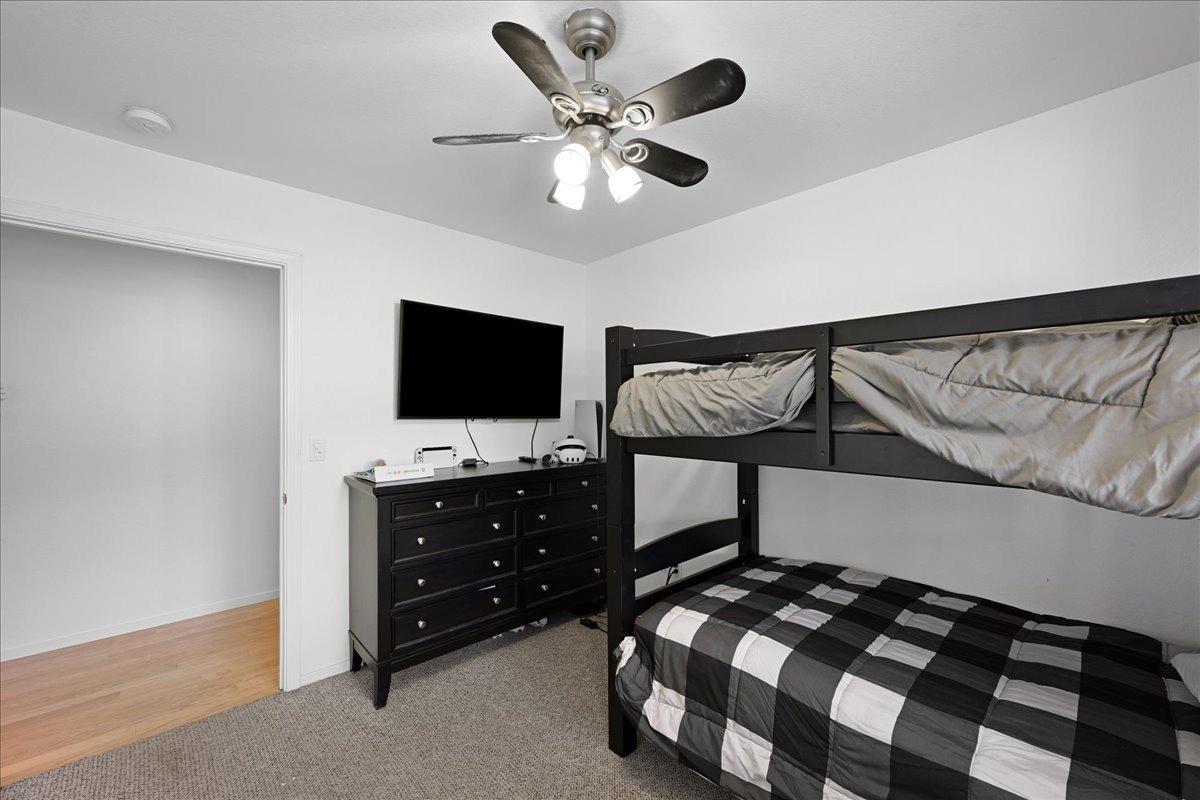 7497 McCourtney Road Lincoln, CA 95648 - Photo 28 of 73 a bedroom with furniture and a flat tv screen