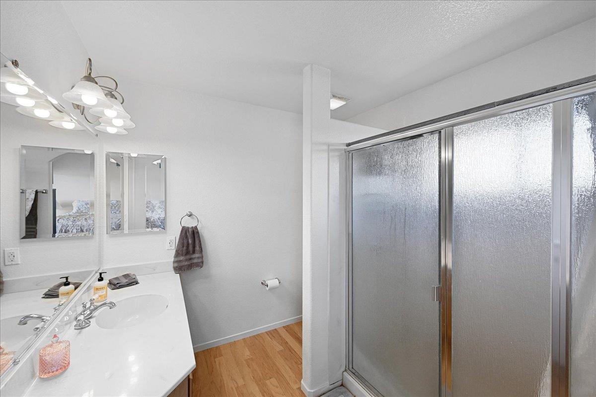 7497 McCourtney Road Lincoln, CA 95648 - Photo 33 of 73 a bathroom with a sink and mirror