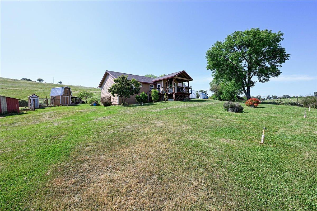 7497 McCourtney Road Lincoln, CA 95648 - Photo 46 of 73 a big house with a big yard and large trees