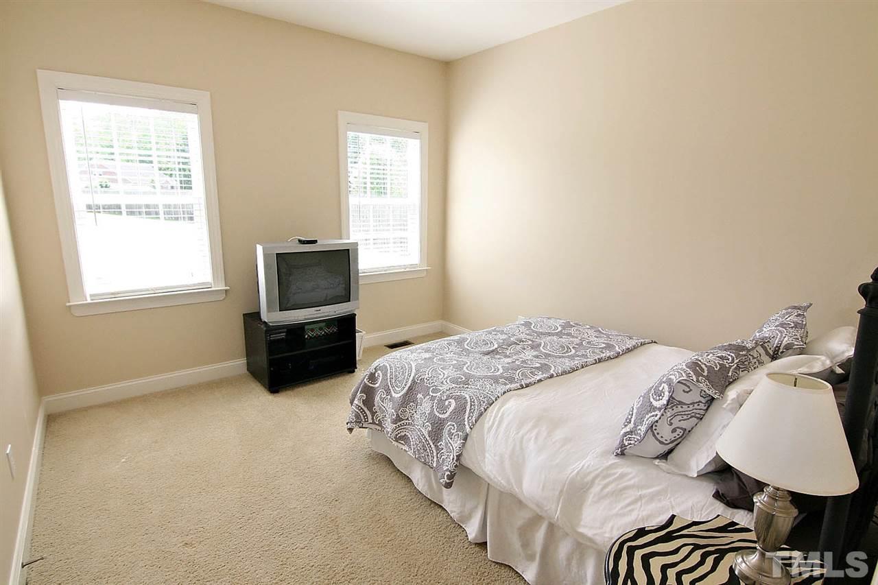 1720 Shell Cracker Drive Willow Spring, NC 27592 - Photo 6 of 10 a bedroom with a bed and a tv