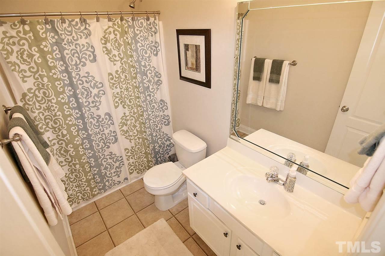 1720 Shell Cracker Drive Willow Spring, NC 27592 - Photo 8 of 10 a bathroom with a sink toilet and shower