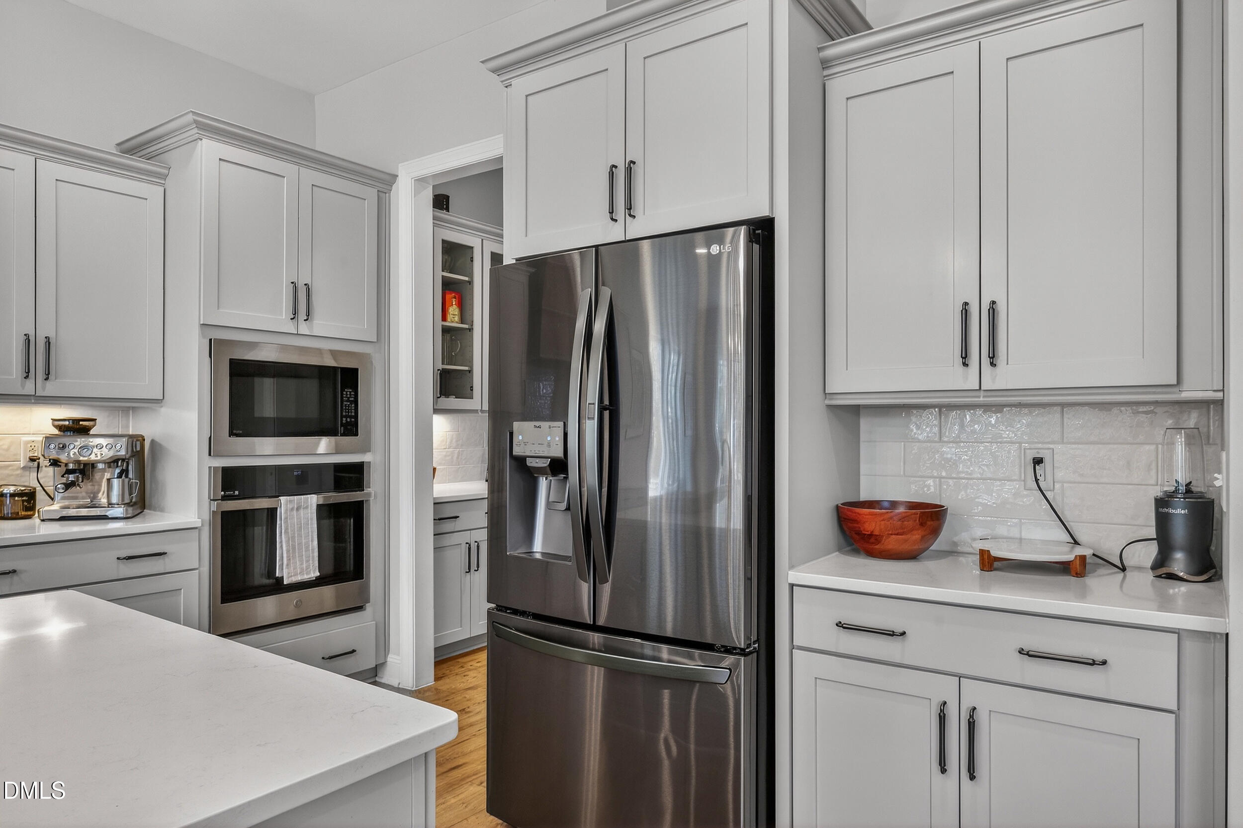 210 Lookout Ridge Pittsboro, NC 27312 - Photo 25 of 59 a kitchen with stainless steel appliances a refrigerator stove and cabinets