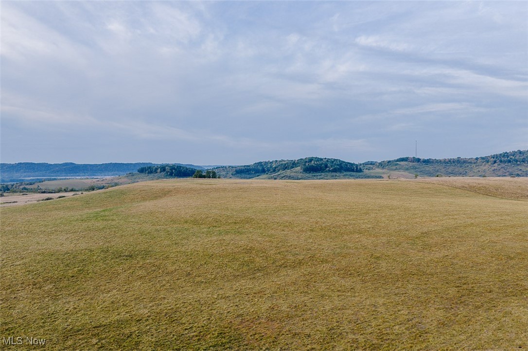 1188 Frys Valley Road Southwest New Philadelphia, OH 44663 - Photo 22 of 50 View of community with a view of rural / pastoral area, a yard, and a mountain view