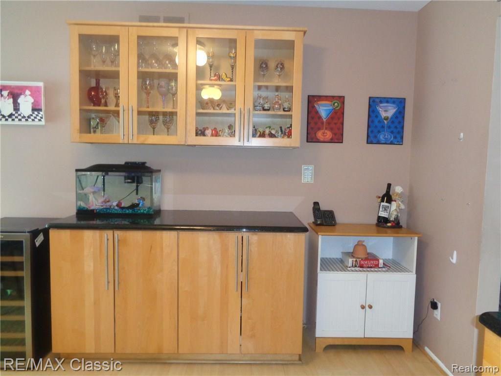 35235 Spring Hill Road Farmington, MI 48331 - Photo 18 of 28 ADDITIONAL WALL OF CABINETRY & GLASS DISPLAY CABINETS